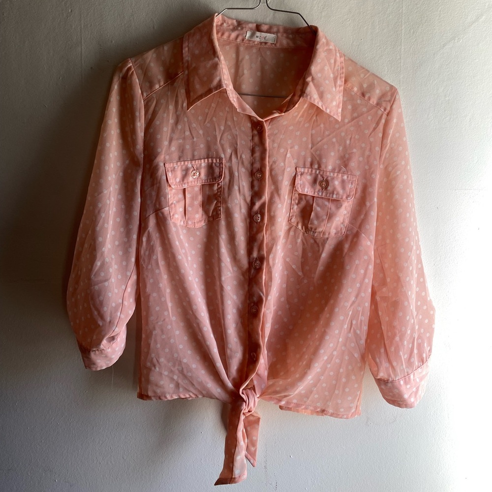 Mine pink polka dotted, tie in front blouse.